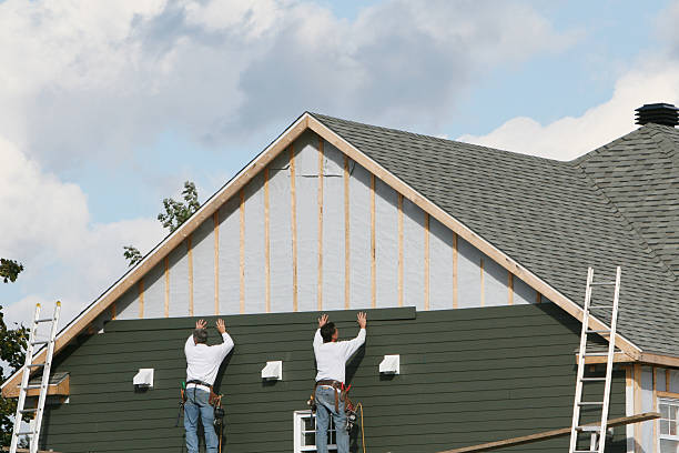 Professional Siding Installation technician working in Longmont, CO